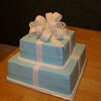 Sany0654Cropped.jpg This is a "tiffany" box cake for a bridal shower. Bow and ribbons are fondant.