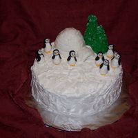 Penguin Cake This is a 12" yellow cake with butter/crisco buttercream icing and filling. Penguins and tiles are fondant. I used the mini wonder...