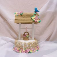Wishing Well 8" round cake with buttercream icing, fondant accents. This cake was so time consuming but it was really fun. Special thanks to my Mom...