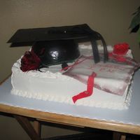 Graduation - Nurse This was made for a graduating nurse. The cap and the diplomo are decorated with fondant.