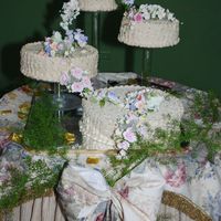 Lizette's Flower Garden Wedding Cake Ivory BC and Yellow cake from scratch. Filled with BC and soaked with brandy syrup. Sugar flowers from Calavaja.