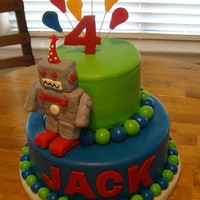 Robot Double layer 9" round bottom and double layer 6' round top. Robot is RKT covered in MMF. Balloons are gumpaste.