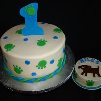 Puppy 1St Birthday 10" round covered in MMF with MMF/gumpaste accents. Smash cake is buttercream with MMF accents.