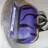 Purple Zebras! 3 layers of durable wedding cake with orange cream cheese filling. Stacked and sculpted, covered in buttercream and then MMF. Handles are...