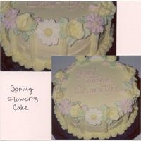 Spring Flowers Cake 8" Round iced in buttercream and decorated with Royal icing daisies and buttercream roses.