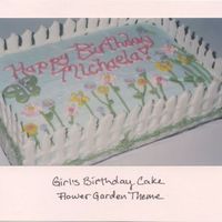 Girl's Birthday- Flower Garden 9x13 cake decorated with piped butterceram flowers. Fence is made from color flow.