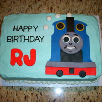 Thomas The Train This cake was made for a friend of a friend's child who loves Thomas. 9 x 13 cake with butter cream icing and Thomas in fondant....