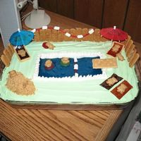 Teddybear Pool Cake The icing is whipped topping with green food coloring, used graham cracker sticks for the fence, marshmallows cut in half for the floats...