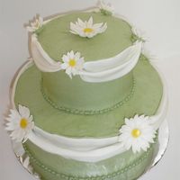 Stacked Daisy Swag Cake I wanted to try fondant swags outside of a class for once. Buttercream with fondant accents.