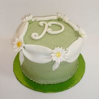 Little Daisy Cake Trying a different kind of fondant swag. This is a side cake to match the stacked daisy cake, for a special birthday. Buttercream with...