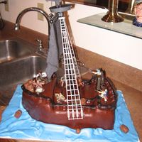 The Black Pearl Chocolate layer cake with IMBC and chocolate mmf with mmf for the blue water. Two rolos melted together for powder kegs and malted...