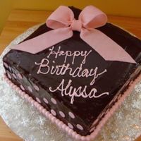 Chocolate Ganache With Pink Fondant Bow/polka Dots Make this for my niece's 8th b-day. Chocolate ganache with fondant bow. It looked better after it was refingerated a while. Everyone...