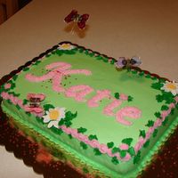 1St Birthday For Katie! Simple white cake with swirls of pink in cake mix prior to baking. Covered in Wildflower's Buttercream, fondant daisys and butterflies...