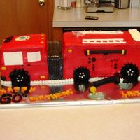 Fire Truck BIG birthday cake for retired firefighter, served 75. White cake with orange/yellow/red swirled buttercream between 3-layers of white cake...