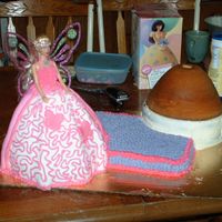 Miranda's 1St Birthday Cake We started with a qtr sheet of yellow, cut out two corners for layers of devils food, wonder mold is yellow, all iced with buttercream....