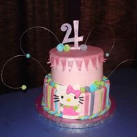 Hello Kitty Buttercream with fondant accents and disco glitter.
