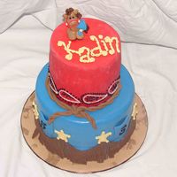 Cowboy Cake All done in fondant. First time making sculpture of animal. 9" rainbow cake and 6" white..... Thanks to all the others before me...