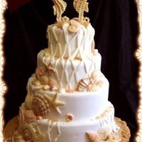 Beach Themed Wedding.. Cake by Ms. Debbie. I am a contracted decorator in her bakery and asked her permission to upload this photo. Hopefully, I'll be doing...