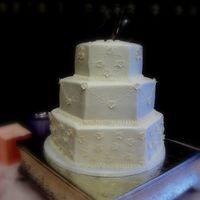 White Hexagon White hexagon with side work and tiny blossoms; topper is difficult to see in pic but are 3 initials