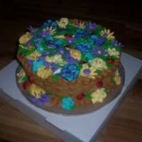 Class_2_Cakes-15.jpg This was my class 2 final cake. I went kinda crazy with the flowers. The ladybugs were a great addition. I took the cake to work and got an...