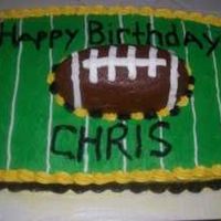 Class_2_Cakes-19.jpg Made this for my friend's son. I didn't get the football centered like i wanted. And as i was getting the saran wrap around it i...