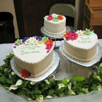 Bridal Shower Heart Cakes Trio of heart cakes for a bridal shower. My very first paid cake!Yellow cake, buttercream icing, royal icing flowers. Top layer pineapple...