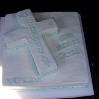 First Communion square is half chocolate and half butter cake, cross is french vanilla cake and frosted inbuttercream