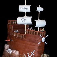 Pirate Ship thanks for the instructions,karensue! and thanks to Angie & Sara for their help! chocolate cake with MMF and gumpaste accents.