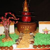 Chinese Temple chocolate chip poundcake strawberry pastry cream filling and granache. decoration is fondant ,graham cracker, coconut and royal icing.