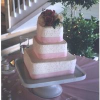 Pretty In Pink This is a 3 tiered white cake, filled with strawberries and cream, covered with a Italian buttercream. It was decorated with a pretty pink...