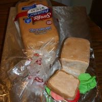 Loaf Of Bread And A Sandwich I made this cake for a friend that works for a bread company. I baked the cake in bread pans then cut slices from the small one to make the...