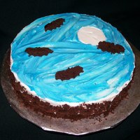 Bat Cake Made for a cake walk. It is devil's food cake with butterscotch mousse filling. Frosted in bc with cake cutouts of bats.