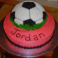Soccer Birthday Wilton's soccer ball pan on top of main cake. All buttercream.