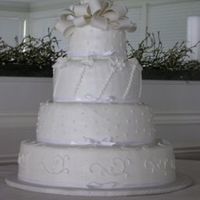 Cakes_For_Files_06-35.jpg Fondant bow tops vanilla cake with raspberry filling iced smooth to perfection with vanilla buttercream, to appear as if rolled fondant.