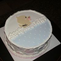 Rubber Duckie...you're The One. chocolate cake, strawberry filling, butter cream icing. Fondant duckie and bubbles on side of cake. Made to match an invitation.