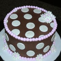Chocolate And Pink With Polka Dots made to match a purse on the baby shower invitation. white cake, cream cheese filling and chocolate buttercream icing. fondant dots and...