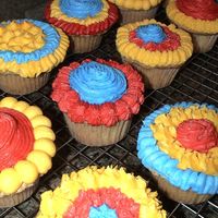 Birthday Explosion Cupcakes made to match previous cake. White cupcakes with BC icing.