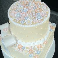 Every Girl Loves Flowers... Bottom tier chocolate cake, butter cream filling, butter cream frosting.Top tier, white cake, butter cream filling, butter cream frosting...