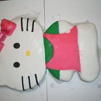 Hello Kitty This is my very first carved cake, and the first time i've ever used fondant. I wished I had covered the cake board with something...