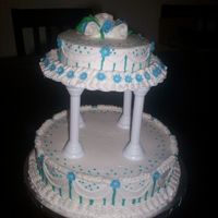 Anniversary Cake This is for a 48th anniversary. Vanilla Cake with Buttercream Icing and fondant accents.