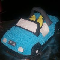 Dune Buggy Cake Lemon Pound cake iced in buttercream, with fondant accents. Roll Bar is a drinking straw.