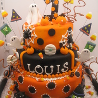 Louis's First Birthday Halloween Bash This was for a first birthday Halloween themed party. All fondant and edible. The only thing not edibe was the glitter twists I added for a...