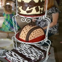 Going Away Animal Print Luggage Cake top two were vanilla cake, bottom was chocolate. iced in buttercream and fondant accents.
