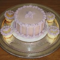 Wascc This is a 6" 2 layer white almond sour cream cake filled and iced with boysenberry buttercream with a few cupcakes. Decorated with the...