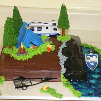 Camping Cake I madethis cake for my grandson. It is buttercream with fondant decorations. The trailor and boat are toys (he likes to have toys included...
