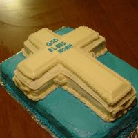 Baptism Cake Cake was 11 x 15 Choc. cake with buttercream icing, and cross was vanilla cake with white buttercream. (customer only wanted BC, no fondant...