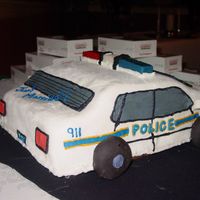 Police Car Grooms Cake A car cake for a groom who is a police officer. Cake is Chocolate with Chocolate Filling, chocolate buttercream crumb coat and MMF. Light...