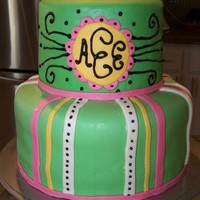 Girl Baby Shower Marshmellow fondant over buttercream. Black was poured cookie icing which hardened nicely to create a shiny glaze.