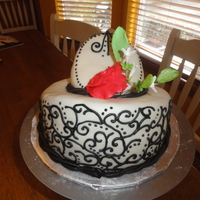 Love And Lace This was a chocolate and white cake covered in BC and then by MMF. THe piping is free had with black royal icing. TFL....