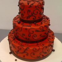 Red And Brown Scrolls red fondant icing with chocolate brown scrolls and balls